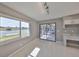 Dining Area with tile floors and large windows providing scenic lake view and natural light at 1806 Wolf Laurel Dr, Sun City Center, FL 33573