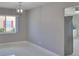 Open dining area with tile floors and views into adjacent room and stainless refrigerator at 1806 Wolf Laurel Dr, Sun City Center, FL 33573