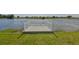 Private dock on a serene lake offers relaxation and waterfront enjoyment at 1806 Wolf Laurel Dr, Sun City Center, FL 33573