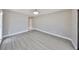 Spacious empty room featuring light gray walls and light-colored floors providing a blank canvas for customization at 1806 Wolf Laurel Dr, Sun City Center, FL 33573
