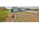 Well-kept front yard featuring mature landscaping, leading to a charming home at 1806 Wolf Laurel Dr, Sun City Center, FL 33573