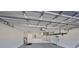 Spacious two-car garage with ample storage, equipped with utility connections and lighting at 1806 Wolf Laurel Dr, Sun City Center, FL 33573