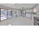 Spacious kitchen with white cabinetry, stainless appliances and a desk area, with outdoor view at 1806 Wolf Laurel Dr, Sun City Center, FL 33573