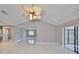 Bright living room boasts high ceilings, tile floors, and a unique ceiling fan fixture at 1806 Wolf Laurel Dr, Sun City Center, FL 33573