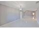 Open living room with tile floors, chandelier, and natural light from adjacent rooms at 1806 Wolf Laurel Dr, Sun City Center, FL 33573