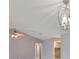 Living room with tile floors, chandelier, and views into adjacent rooms at 1806 Wolf Laurel Dr, Sun City Center, FL 33573