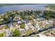 Aerial view of a waterfront neighborhood with homes along a canal, leading to a large lake at 182 E Canal Dr, Palm Harbor, FL 34684