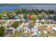Expansive aerial view showcasing the waterfront property, private boat dock, and serene neighborhood atmosphere at 182 E Canal Dr, Palm Harbor, FL 34684