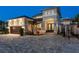 Two-story home with a gray exterior, double doors, and a brick driveway and boat parked out front at 182 E Canal Dr, Palm Harbor, FL 34684