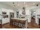 Bright kitchen boasts a center island with seating, stainless steel appliances, and pendant lighting at 182 E Canal Dr, Palm Harbor, FL 34684