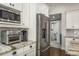 Modern kitchen with stainless steel refrigerator, granite countertops, and stainless steel microwave at 182 E Canal Dr, Palm Harbor, FL 34684