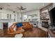 Inviting living area with stone fireplace, wet bar, and seamless access to outdoor living at 182 E Canal Dr, Palm Harbor, FL 34684