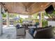 Covered outdoor space complete with built-in bar, grill, and ample seating at 182 E Canal Dr, Palm Harbor, FL 34684