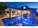 Stunning pool area with a covered patio, lounge chairs, and built-in bar, perfect for outdoor entertaining at 182 E Canal Dr, Palm Harbor, FL 34684