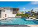 Beautiful pool area with a jacuzzi, in-water seating, and a view of the canal at 182 E Canal Dr, Palm Harbor, FL 34684