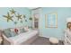 Charming bedroom with starfish decor, daybed, and a bright, inviting atmosphere at 1880 Longliner Loop, Wesley Chapel, FL 33543