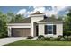 Charming single-Gathering home featuring a two-car garage, manicured lawn, and classic architectural details at 1880 Longliner Loop, Wesley Chapel, FL 33543