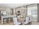 Open-concept kitchen and dining area with stainless steel appliances and ample counter space at 1880 Longliner Loop, Wesley Chapel, FL 33543