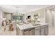 Modern kitchen island with a breakfast bar and stainless steel dishwasher at 1880 Longliner Loop, Wesley Chapel, FL 33543