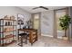 Functional home office with built-in shelving, natural light, and a comfortable workspace at 1880 Longliner Loop, Wesley Chapel, FL 33543