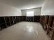 An empty bedroom showing tile floor, the framework of the walls and a window at 200 Country Club Dr # 1101, Largo, FL 33771