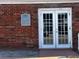 Exterior view of community fitness center entrance with brick facade and double doors at 200 Country Club Dr # 1101, Largo, FL 33771