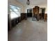 A kitchen area featuring exposed framework, a window, and essential plumbing installations at 200 Country Club Dr # 1101, Largo, FL 33771