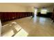 Living room area showing the studs, tile floor and a bright window at 200 Country Club Dr # 1101, Largo, FL 33771