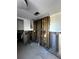 Open room showing exposed wall studs, plumbing, and electrical with a water heater ready for renovation at 200 Country Club Dr # 1101, Largo, FL 33771