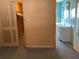 A bedroom shows doorway access and features an adjacent closet and window for natural light at 2001 E Powhatan Ave, Tampa, FL 33610