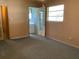 The bedroom provides comfort and privacy, with access to rooms and a window for natural light at 2001 E Powhatan Ave, Tampa, FL 33610