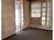 A bedroom with light filtering window shades provides a calm and private setting at 2001 E Powhatan Ave, Tampa, FL 33610
