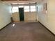 The bonus room provides extra space with a green door and multiple windows for natural light at 2001 E Powhatan Ave, Tampa, FL 33610