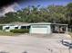 Single story home with a covered entry, attached garage and driveway at 2001 E Powhatan Ave, Tampa, FL 33610