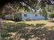 Exterior view of the property featuring a lawn at 2001 E Powhatan Ave, Tampa, FL 33610