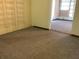 Living room with neutral carpet and access to other rooms at 2001 E Powhatan Ave, Tampa, FL 33610