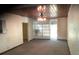 The living room offers a ceiling fan and sliding glass doors for natural light and airflow at 2001 E Powhatan Ave, Tampa, FL 33610