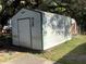 Backyard shed featuring double doors and space for storage at 2001 E Powhatan Ave, Tampa, FL 33610