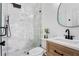 Updated bathroom with a glass shower, marble tiling, and sleek, modern fixtures at 207 S Coolidge Ave, Tampa, FL 33609