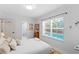 Bright bedroom with a view of the pool, featuring neutral decor and natural light at 207 S Coolidge Ave, Tampa, FL 33609