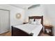 Bedroom featuring a window, dark wood bed frame and neutral decor at 207 S Coolidge Ave, Tampa, FL 33609