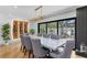 Elegant dining room featuring a marble table, unique chandelier, and a custom wine rack at 207 S Coolidge Ave, Tampa, FL 33609