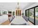 Dining room with marble table, custom wine rack, and a view of the backyard at 207 S Coolidge Ave, Tampa, FL 33609