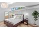 Bright main bedroom with hardwood flooring, accent lighting, and a beautiful window at 207 S Coolidge Ave, Tampa, FL 33609