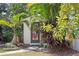 Charming backyard shed with a brick walkway, surrounded by lush tropical landscaping for added privacy at 207 S Coolidge Ave, Tampa, FL 33609