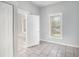 Cozy bedroom with tile flooring, closet, and a window for natural light at 2317 W Chestnut St, Tampa, FL 33607