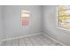 Bedroom featuring tile flooring and natural light from the windows at 2317 W Chestnut St, Tampa, FL 33607