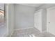 Small bedroom showing tile flooring, closet space, and a bright window at 2317 W Chestnut St, Tampa, FL 33607