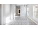 Open-concept living space featuring tile flooring and abundant natural light at 2317 W Chestnut St, Tampa, FL 33607