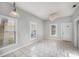 Bright living room with tile flooring, neutral paint, and ample natural light at 2317 W Chestnut St, Tampa, FL 33607